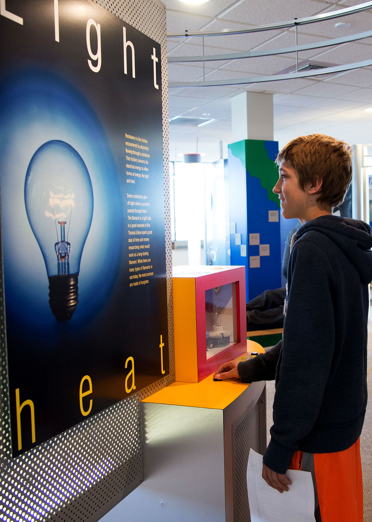 Visitor learning about the relationship between light and heat.