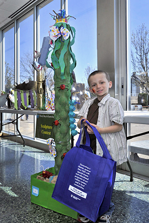 Young boy with sculpture